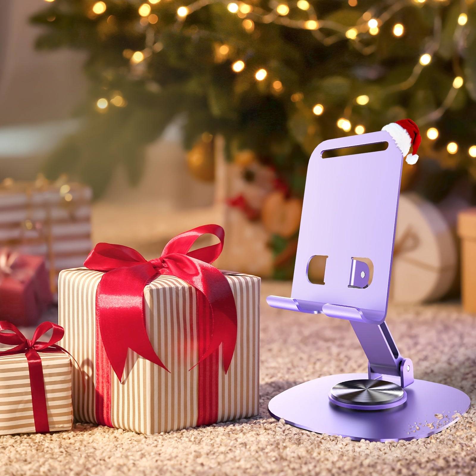 Metal desktop phone stand with 360° rotating base, foldable design, silicone pads, and mechanical click