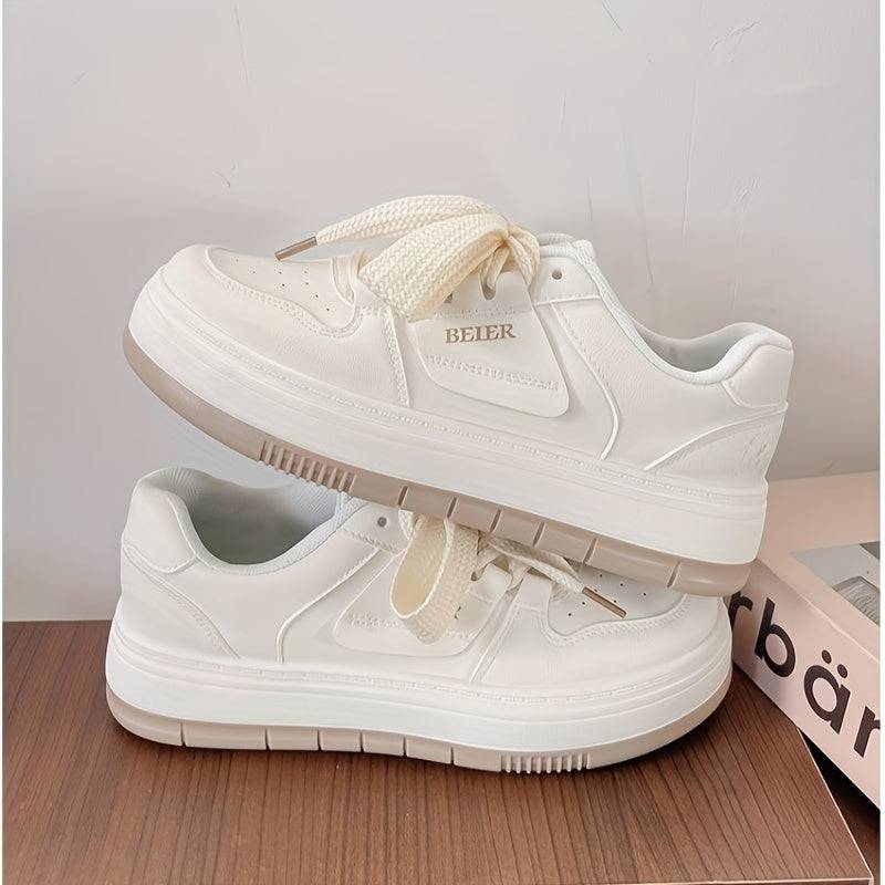 Comfortable women’s lace-up sneakers in white with a chunky sole and breathable design, perfect for casual daily outfits.