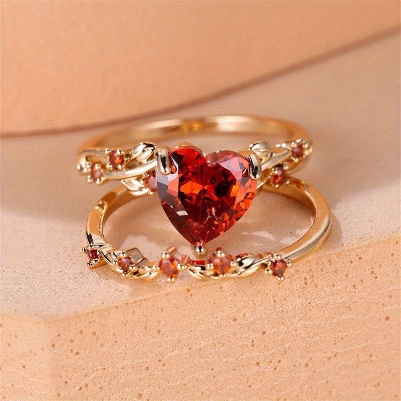 Heart-shaped gold-plated ring set for women with red cubic zirconia stones, featuring a vintage design and intricate detailing, ideal for gifts or parties.