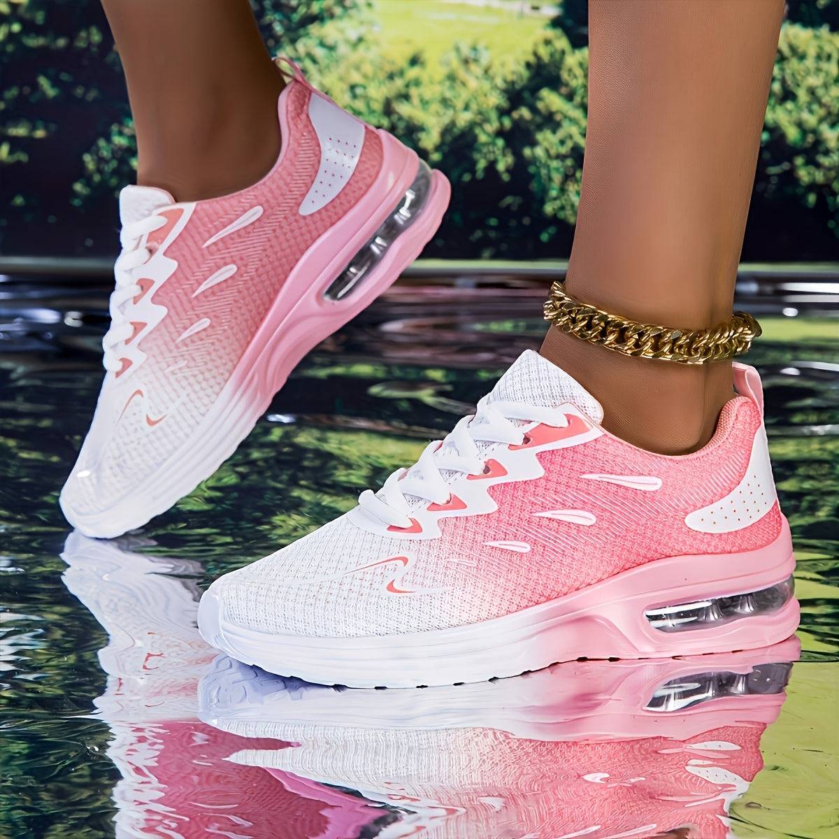 Lightweight pink and white women's mesh sneakers with air cushion sole, ideal for comfort and breathability in active wear.